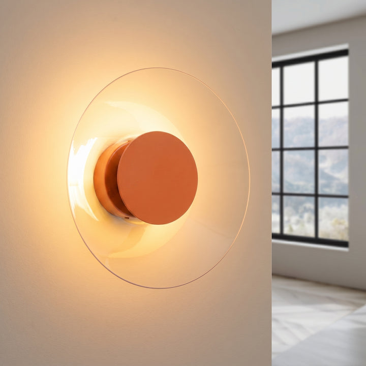 Applique murale ASTRO ocre rouge allumée, halo derrière le disque