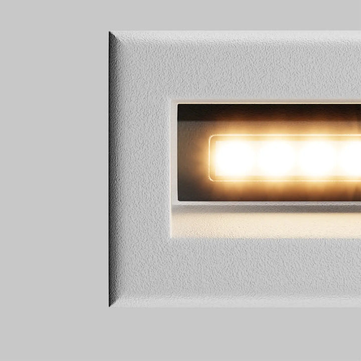 Applique encastrable bosca blanche texturée avec éclairage led chaud idéale pour l installation le long d une allée