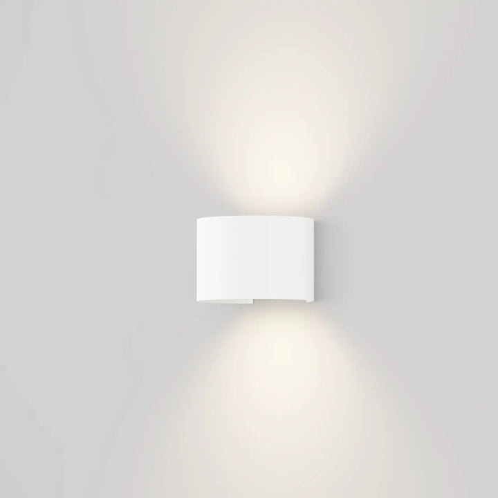 Applique extérieure fulton blanc cylindre en volume arrondi avec double faisceau au design minimaliste