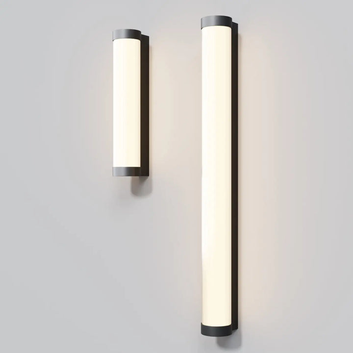 Applique extérieure led tube rounge en aluminium noir avec cadre minimaliste noir et éclairage led diffus chaud