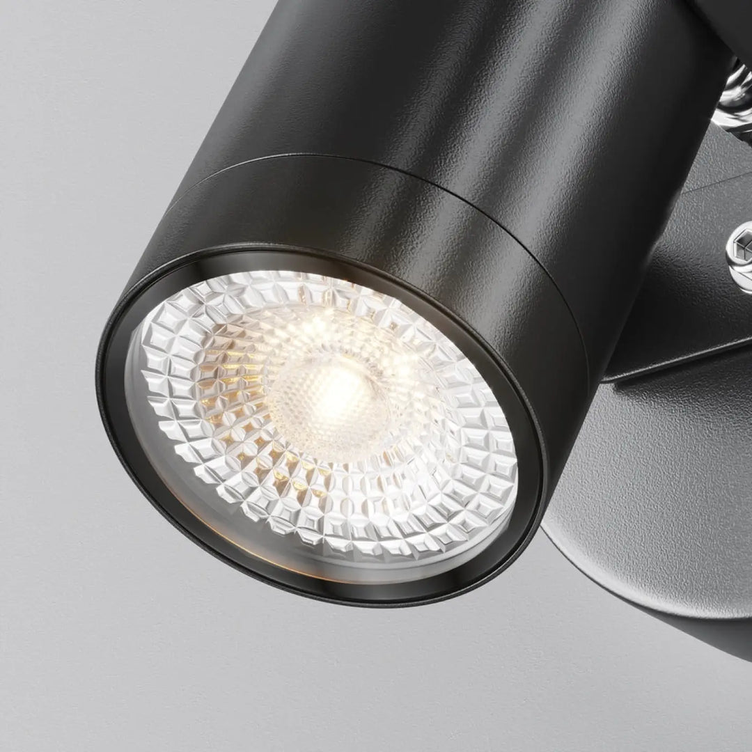 Applique extérieure scope projecteur orientable en acier noir avec finition texturée et lentille facettée claire