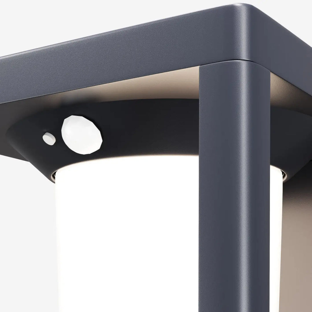 Applique extérieure solaire shatter en acier noir avec cadre métallique gris foncé et corps de lampe cylindrique blanc