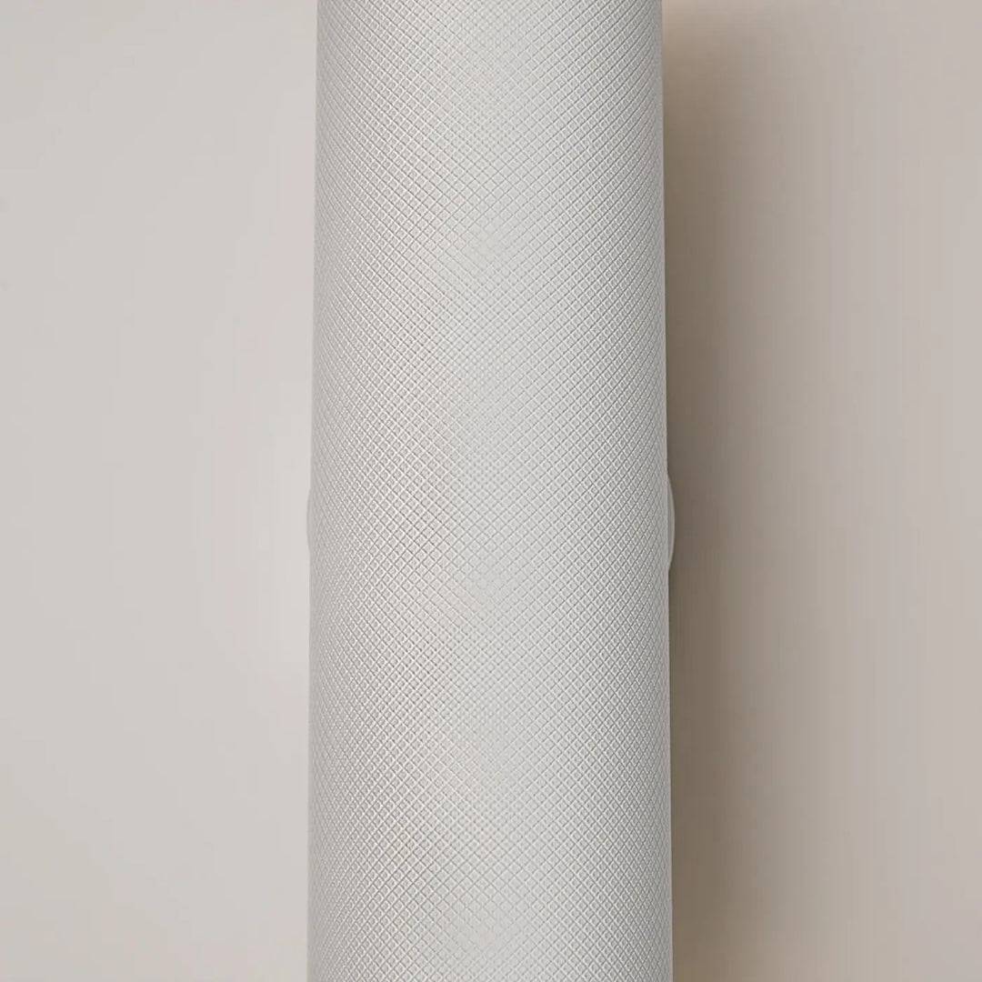 Applique murale artisan en forme cylindrique gris clair avec surface texturée pour éclairage d’accent moderne