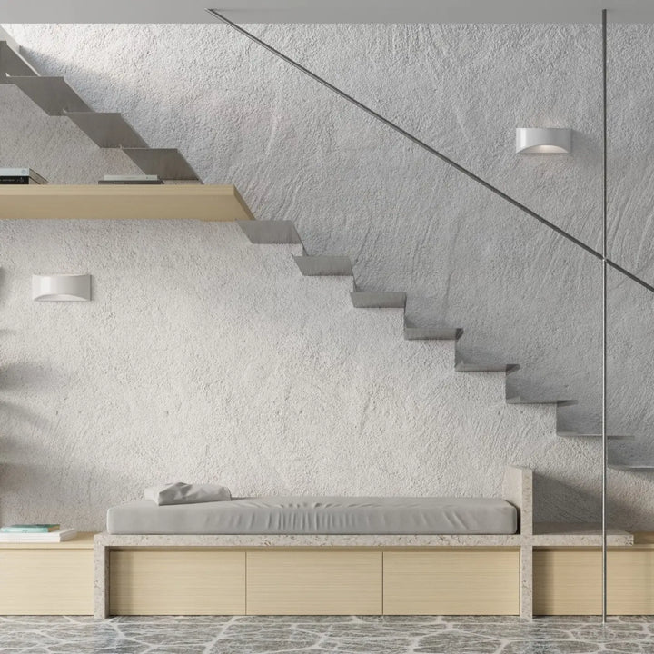 Minimalist gray upholstered bench with light wood frame and integrated storage drawers for céramique vixen display