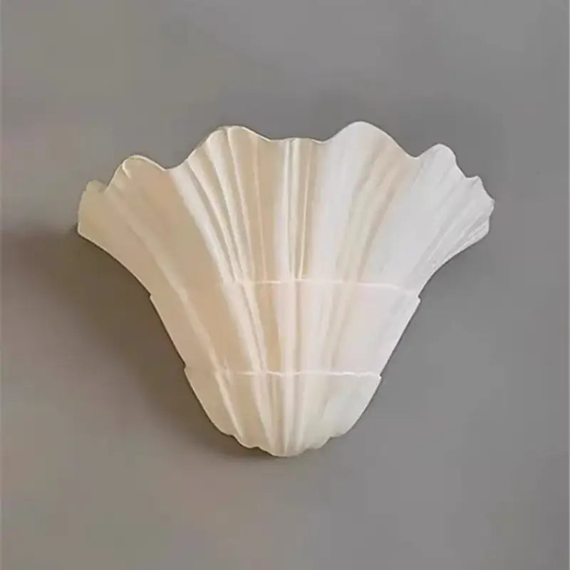 Applique murale blanche en forme de coquillage au style marin