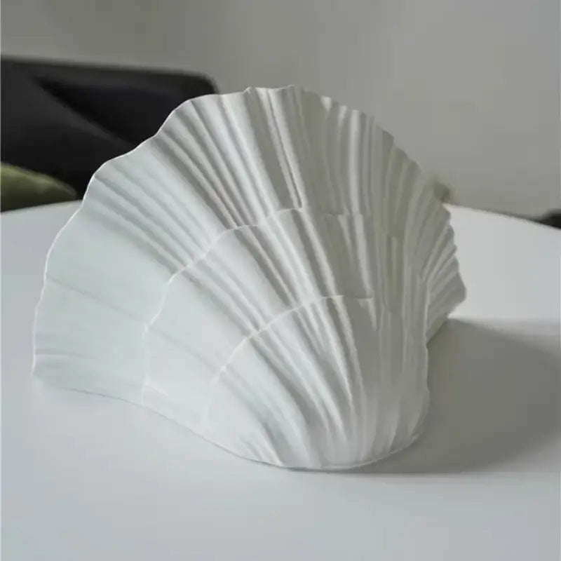 Applique murale blanche en forme de coquillage au style marin