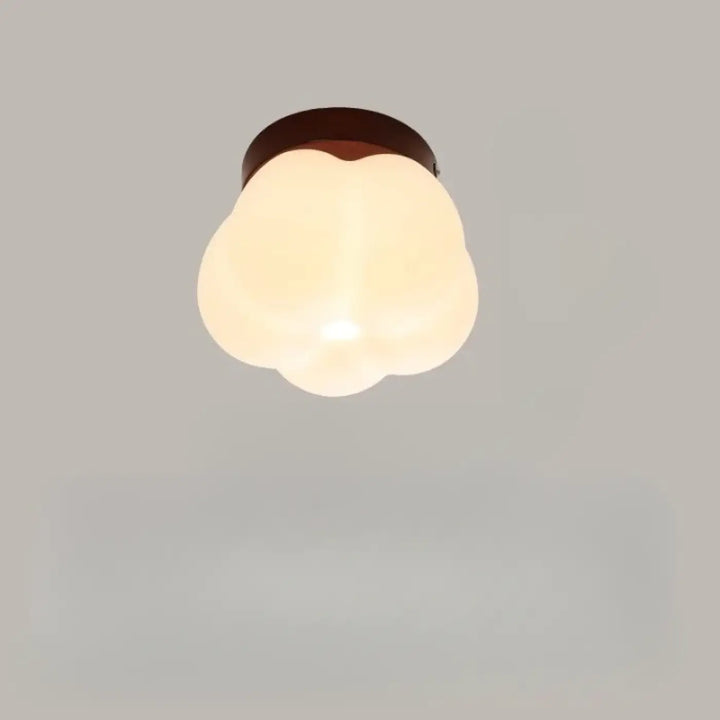 Applique murale puffo avec abat-jours arrondis en verre dépoli et anneau métallique brun foncé design doux chaleureux