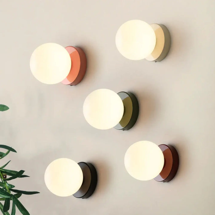Applique murale puffo à abat-jours arrondis avec bases mate terracotta olive et brun pour un murale design doux