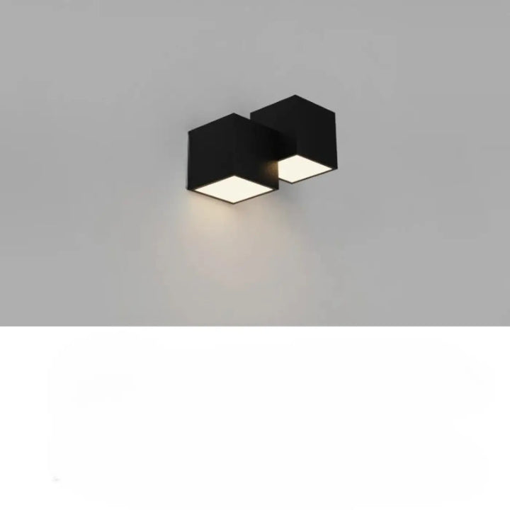 Applique murale noire hexagonale kubora avec deux carrés flottants lumineux pour effet lumineux décoratif