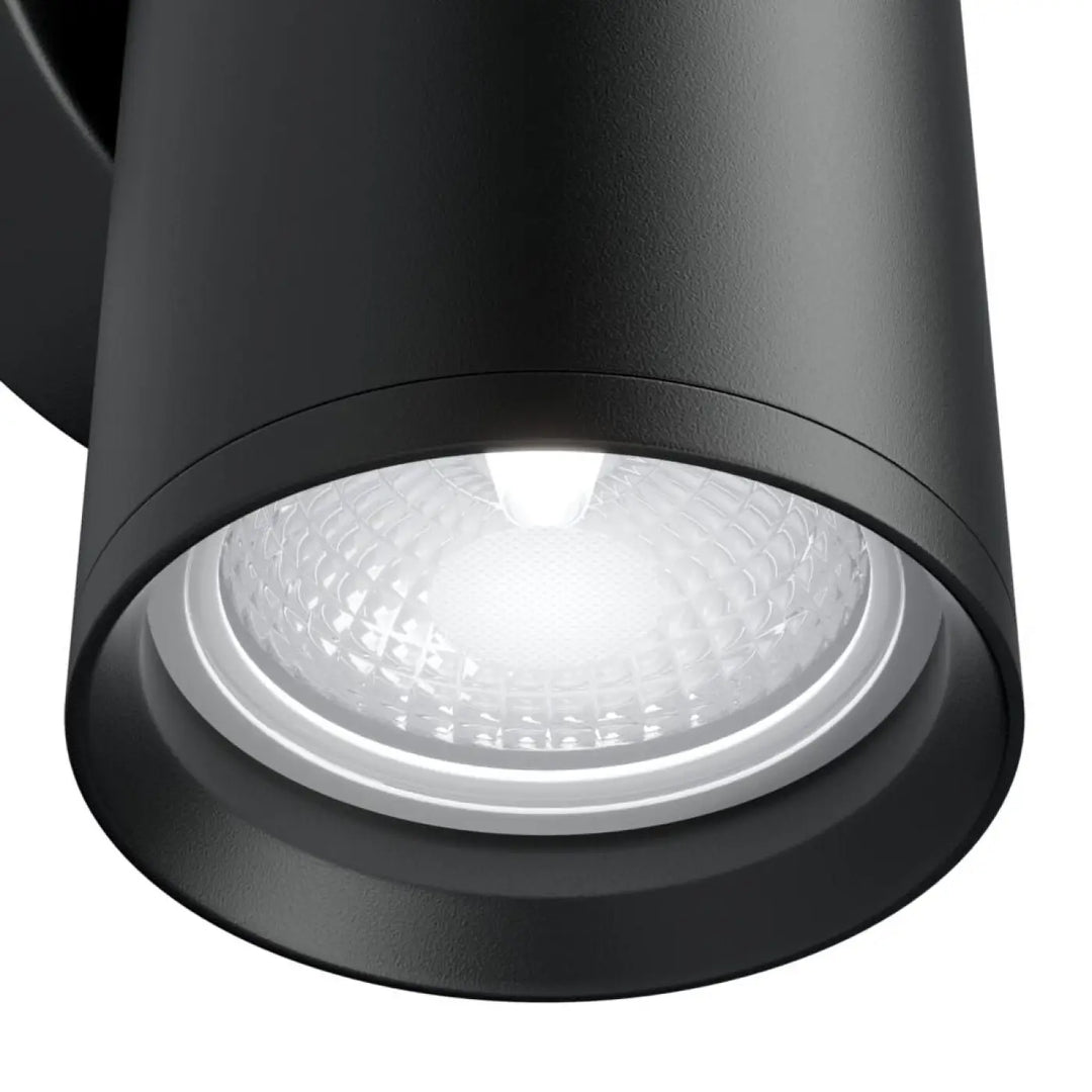 Applique murale focus cylindre géométrique noir en finition mate texturée avec ampoule led éclairée