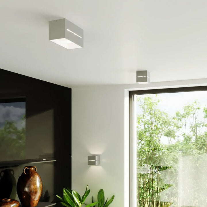 Applique murale lobo grise moderne avec perforation linéaire et éclairage led intégré pour un design minimaliste