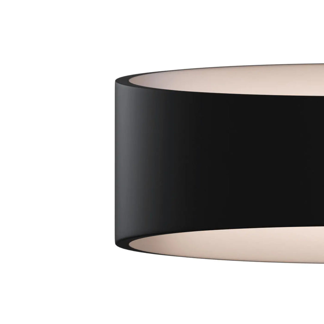 Applique murale trame elliptique avec abat-jour cylindrique noir mat et lumière rasante intérieure diffusée doucement