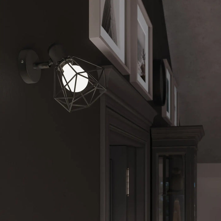 Applique murale série artemis noir en métal géométrique avec ampoule blanche pour créer une atmosphère intime
