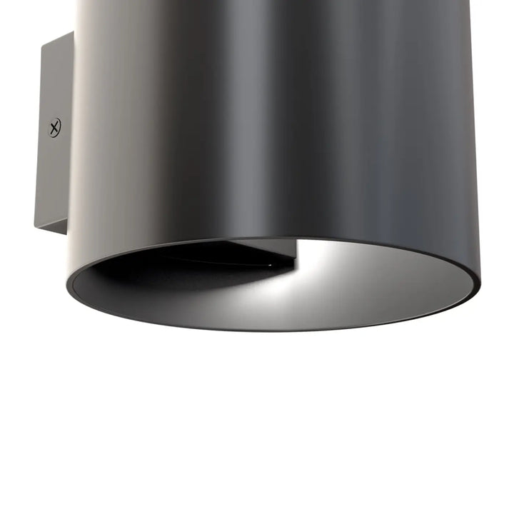 Applique murale rond cylindrique mat noir avec support en métal brossé pour une lumière douce et design moderne