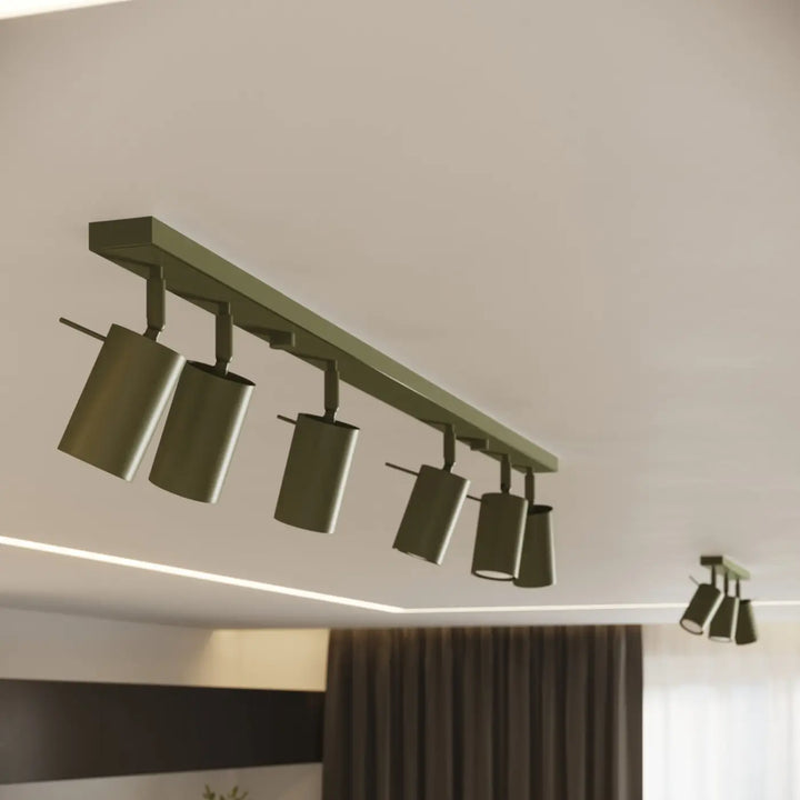 Applique murale vert olive allumée, vue rapprochée