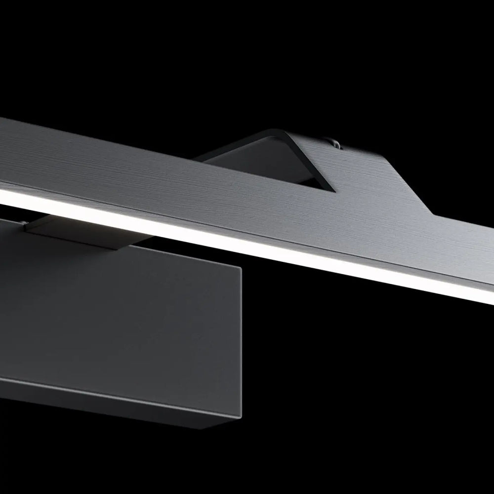 Applique murale led linéaire métal noir avec lumière neutre et design minimaliste au-dessus d’un tableau