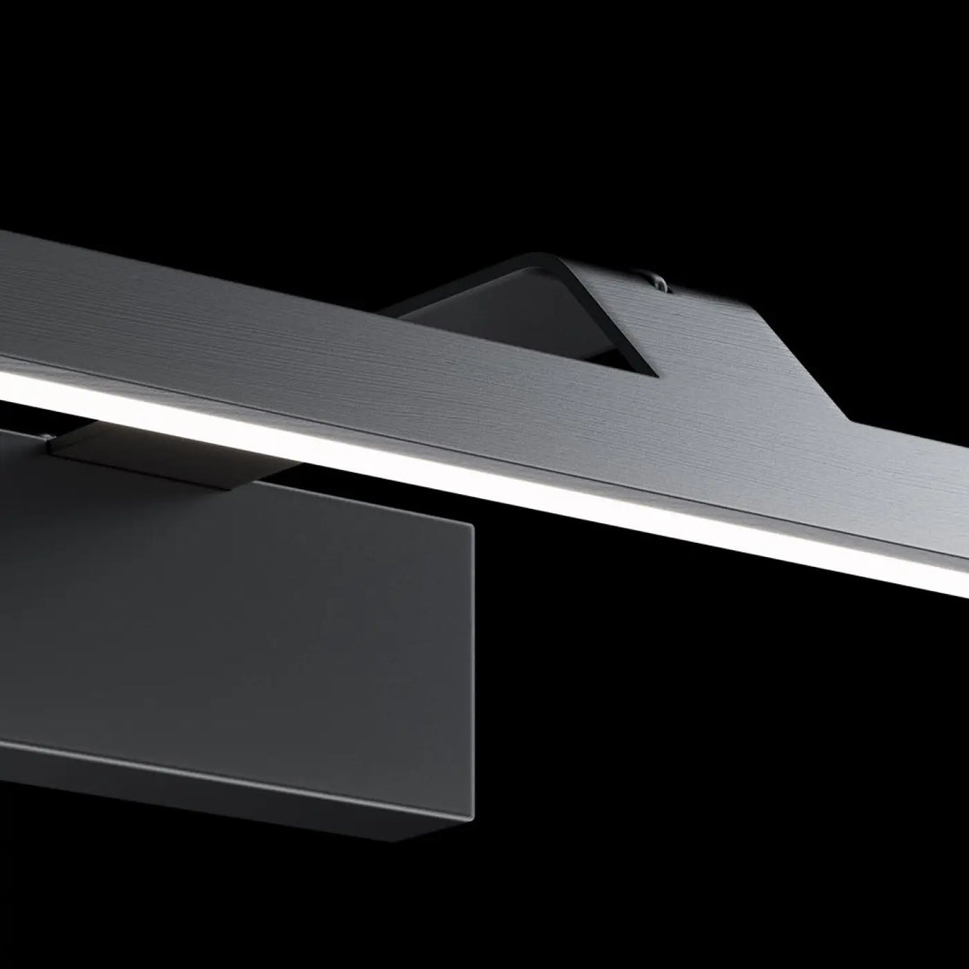 Applique murale led linéaire métal noir avec lumière neutre et design minimaliste au-dessus d’un tableau