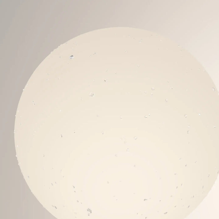 Borne extérieure bold globe opale crème tachetée avec lumière douce et surface lisse sphérique