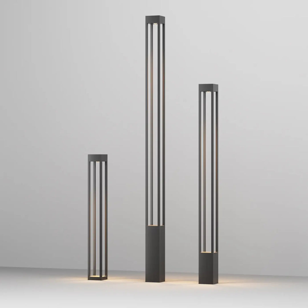 Borne extérieure elbe carrée avec profil carré en aluminium gris et lumière chaude dans un cadre métallique noir minimaliste