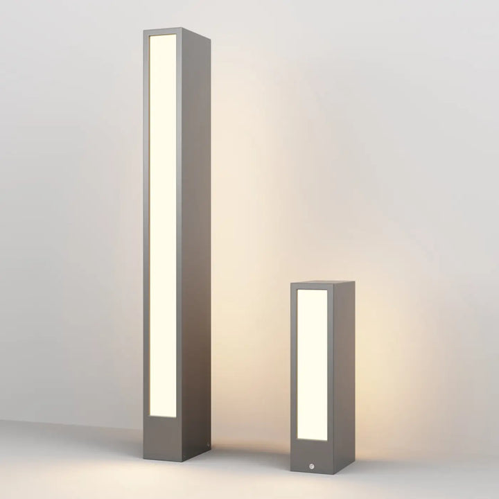 Borne extérieur hof rectangulaire en acier gris avec profil rectangulaire et version basse éclairage led moderne et chaleureux