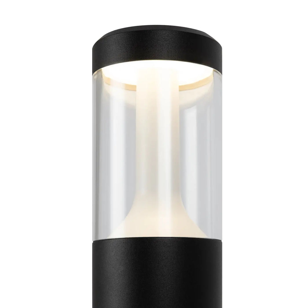 Borne extérieure cylindrique acier noir avec lumière claire led dans un lanterne moderne en verre transparent