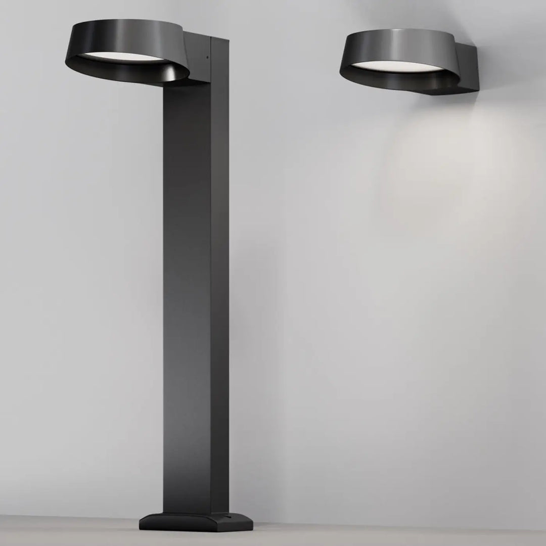 Borne extérieure led noire en métal moderne avec un luminaire circulaire incurvé pour éclairage extérieur design
