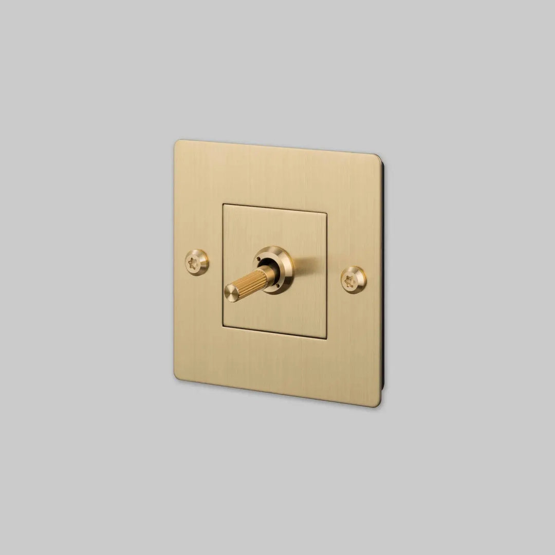 Interrupteur à levier Toggle à gravure alignée sans logo doré, finition laiton #couleur_dor