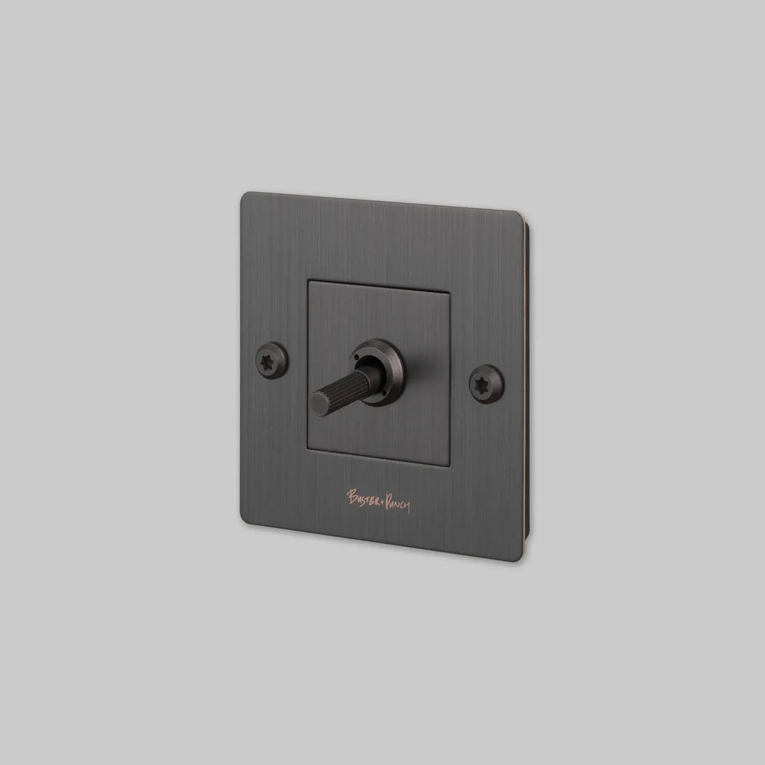 Interrupteur à levier Toggle à gravure alignée avec logo bronze fumé #couleur_gris