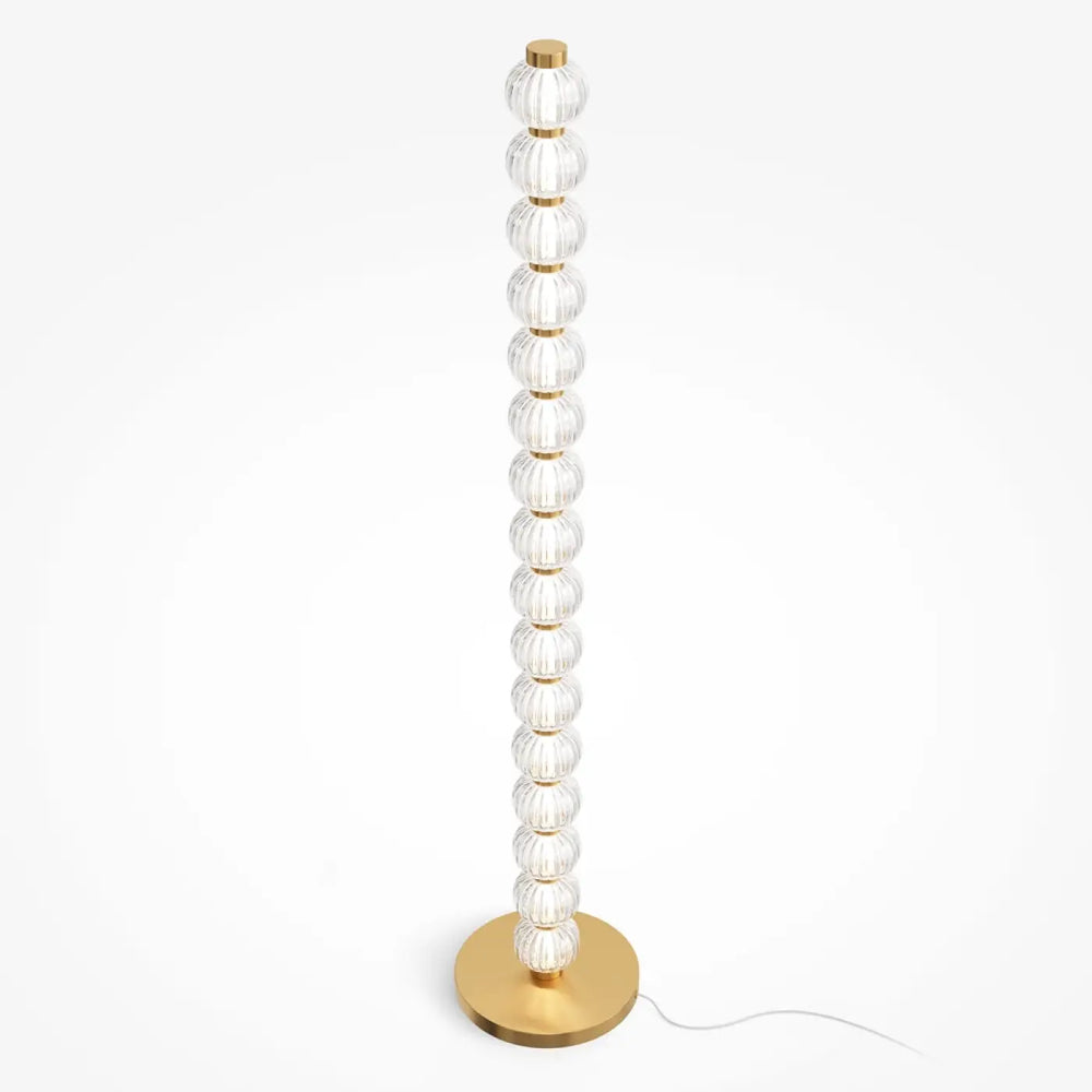 Lampadaire amulet en métal doré avec des orbes en verre strié empilées verticalement sur base élégante