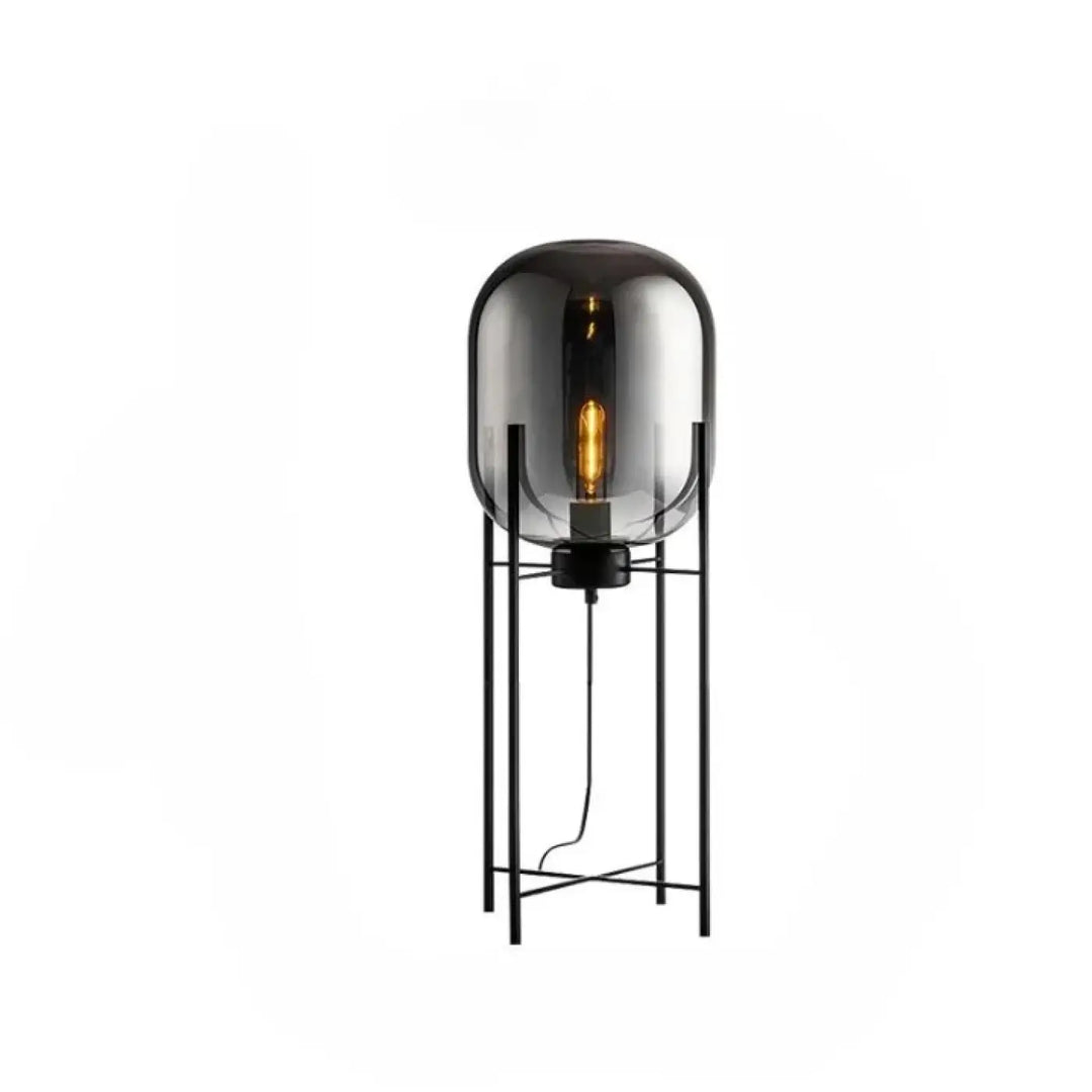 Lampadaire vito noir en verre avec une ampoule à filament visible et effet abat-jour ambre pour espace applicable moderne
