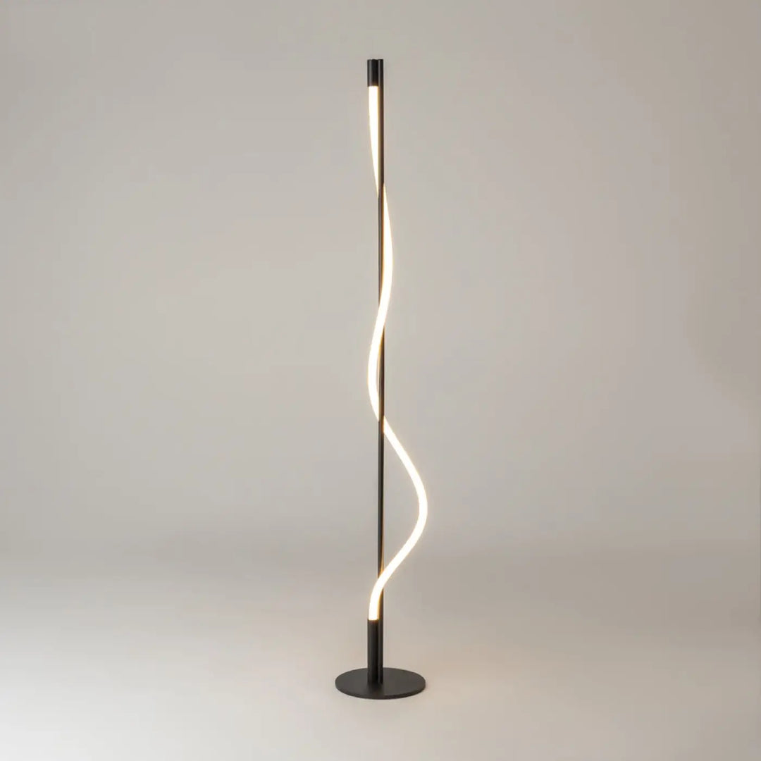 Lampadaire tau noir moderne avec ruban lumineux led torsadé et cadre mince diffusant une lumière chaude