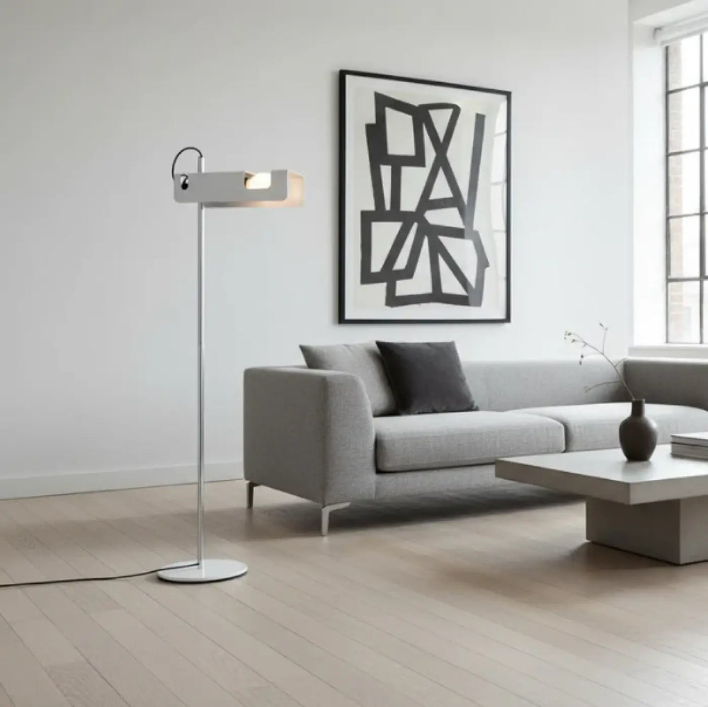 Lampadaire moderne orix avec finition métallique argentée et tête rectangulaire pour éclairage directionnel structure fine