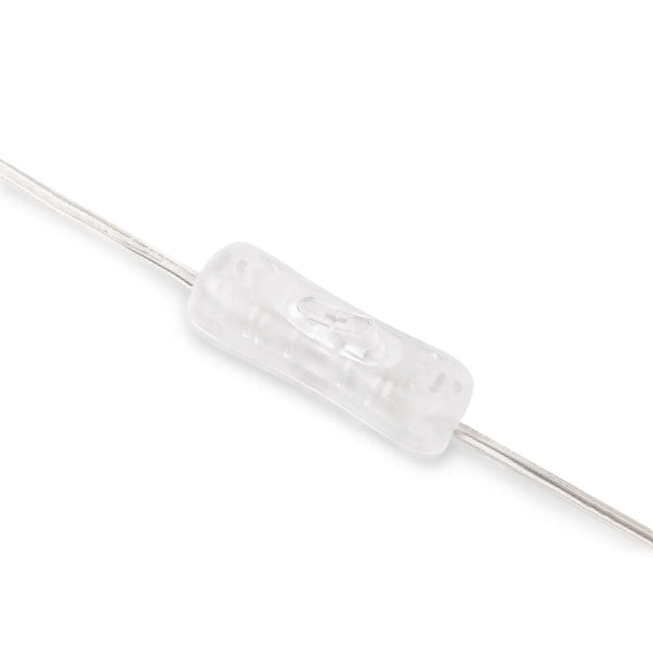 Clear toggle switch en plastique transparent avec surface texturée et composants internes visibles pour lampe memory à poser en céramique