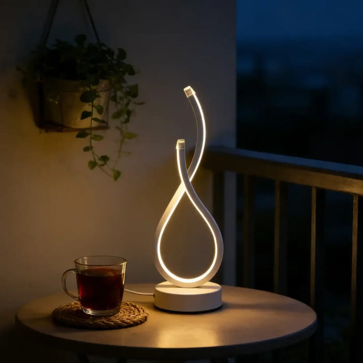 Lampe de table infinia avec boucle lumineuse led blanc néon en forme de silhouette sculpturale design moderne