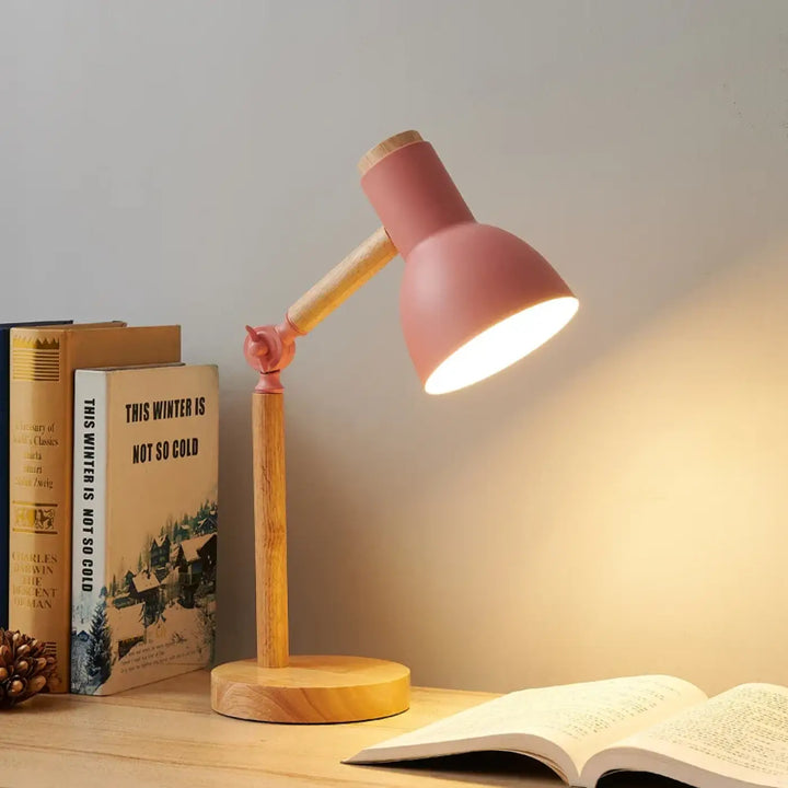 Lampe de table natax en métal rose avec base en bois et bras articulé sont-elles incluses question essentielle