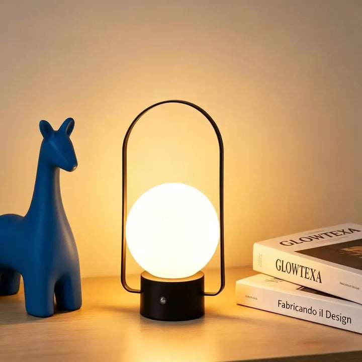Lampe de table archelia avec sphère lumineuse blanche et arche métallique élégante en métal noir moderne