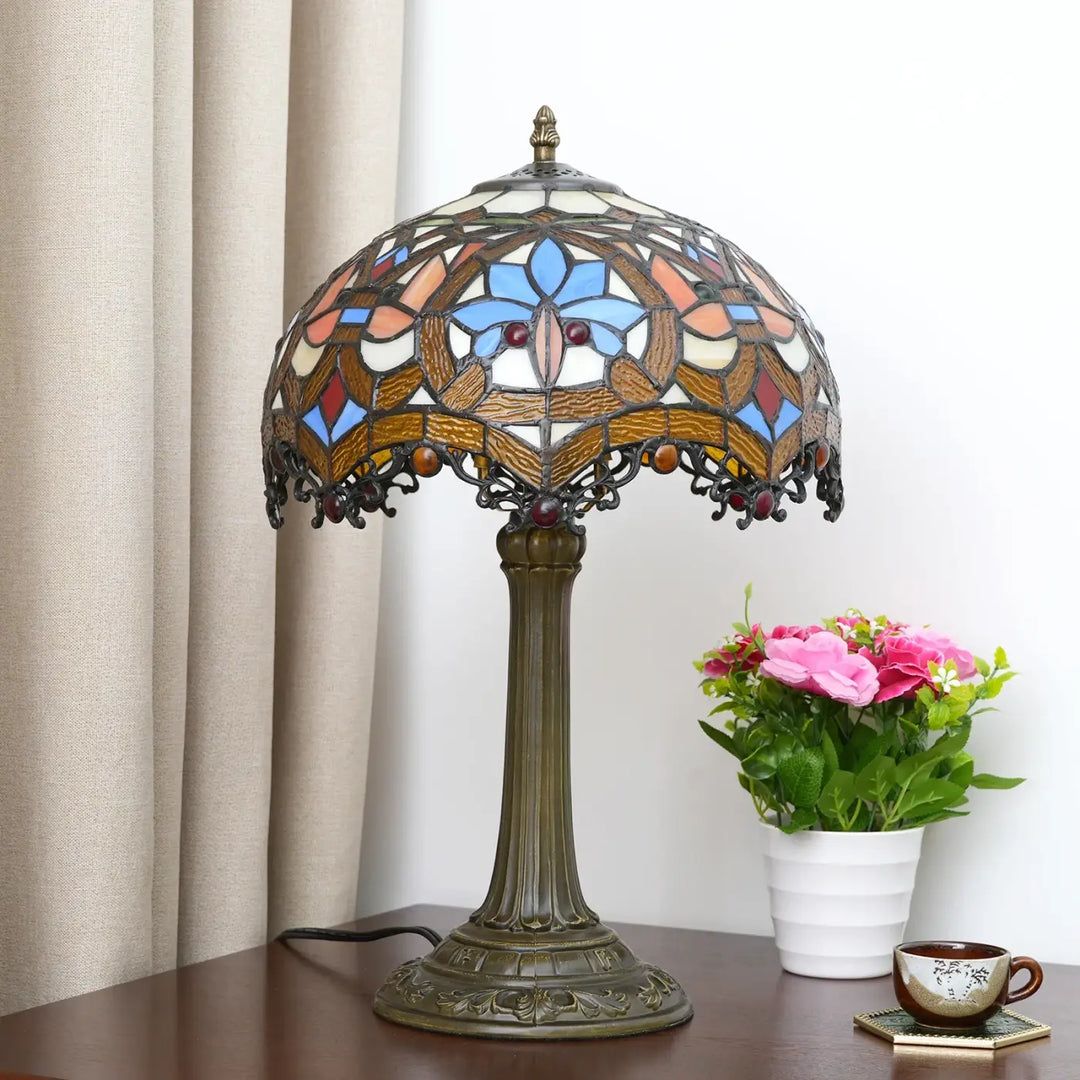 Lampe de table Nanih style vintage avec abat-jour en verre teinté bleu orange crème et base en bronze ornée