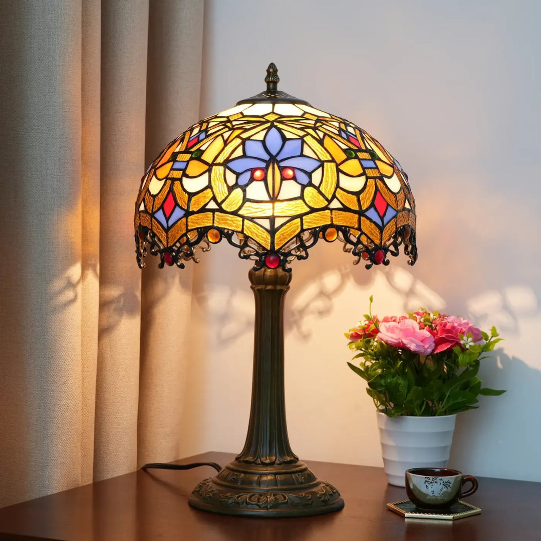 Lampe de table Nanih vintage style tiffany avec abat-jour en verre teinté floral jaune bleu rouge base en métal bronze