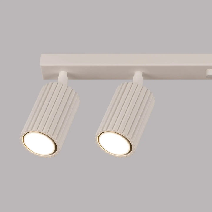 Plafonnier karbon allie blanc à tiges cannelées avec ampoules gu10 interchangeables design minimaliste beige