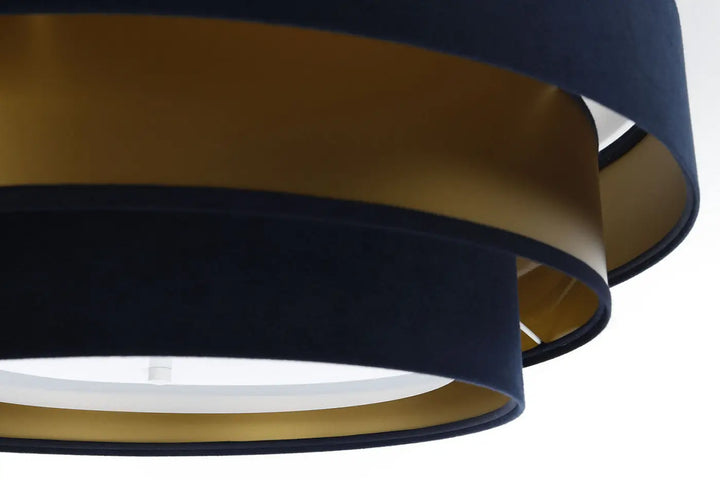 Luminaire plafonnier bleu marine avec anneaux concentriques en velours bleu marine et tissu métallique doré moderne