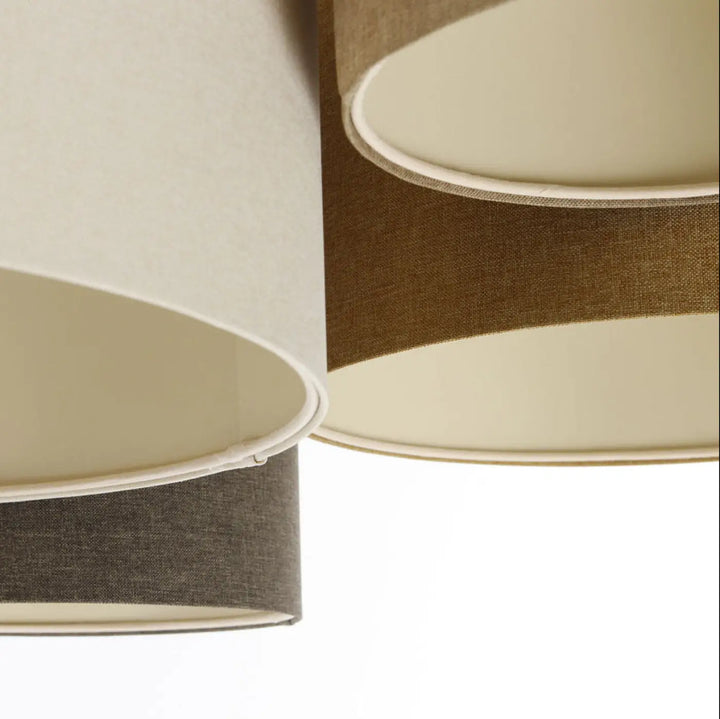 Luminaire plafond 4flames boho elegant avec trois abat-jours cylindriques en tissu naturel crème beige et graphite