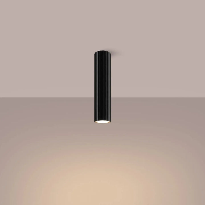 Plafonnier karbon allie noir cylindrique avec rainures verticales et base illuminée lumière chaude ampoules gu10 interchangeables design minimaliste
