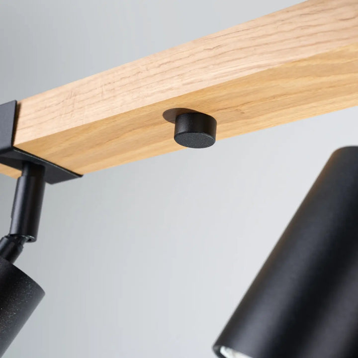 Lampe directionnelle fager 4l noir avec abat-jours orientables en boîtier moderne fixé sur poutre en bois