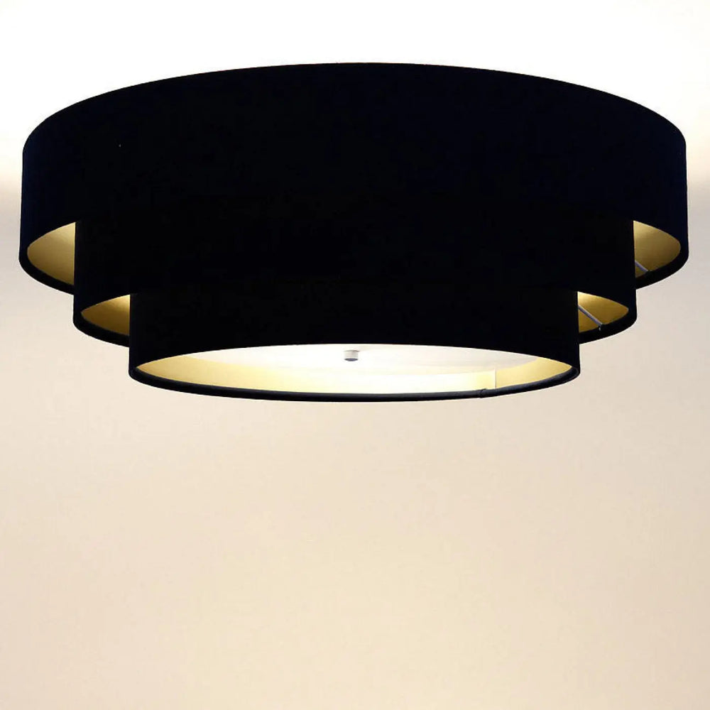 Luminaire plafonnier noir en velours avec doublure dorée et design moderne en cercles superposés triniti veloursstoff