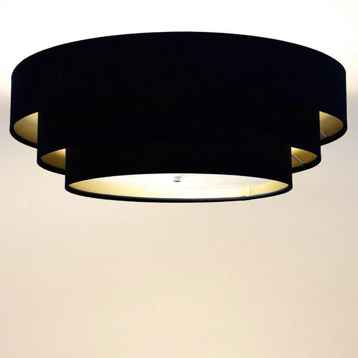 Luminaire plafonnier noir en velours avec doublure dorée et design moderne en cercles superposés triniti veloursstoff