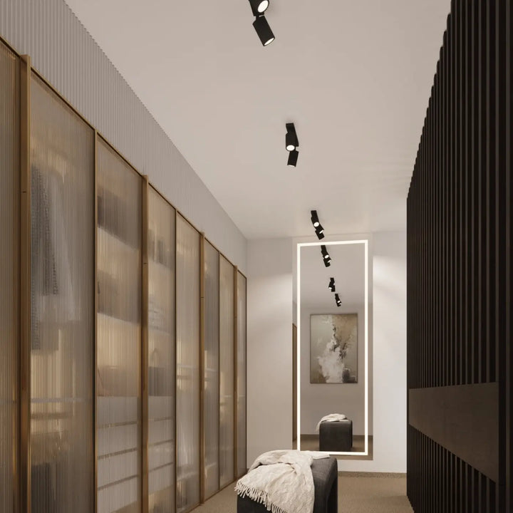 Luminaire plafonnier karbon 4 noir avec ampoules gu10 interchangeables et design minimaliste monté au plafond blanc