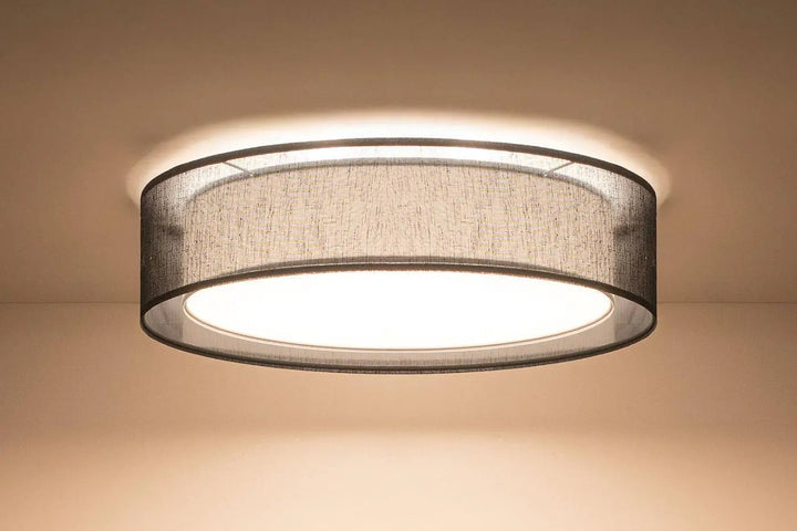 Luminaire plafonnier noir circulaire avec abat-jour en tissu gris foncé texturé et cadre métallique élégant puRO