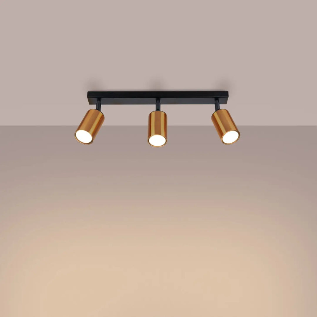 Luminaire plafonnier winx 3 noir avec trois spots cylindriques ajustables finition cuivre pour un design winx allie moderne