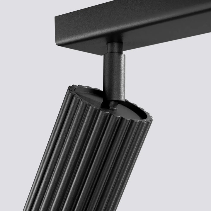 Plafonnier karbon allie noir mat avec corps cylindrique à rainures verticales et ampoules gu10 interchangeables