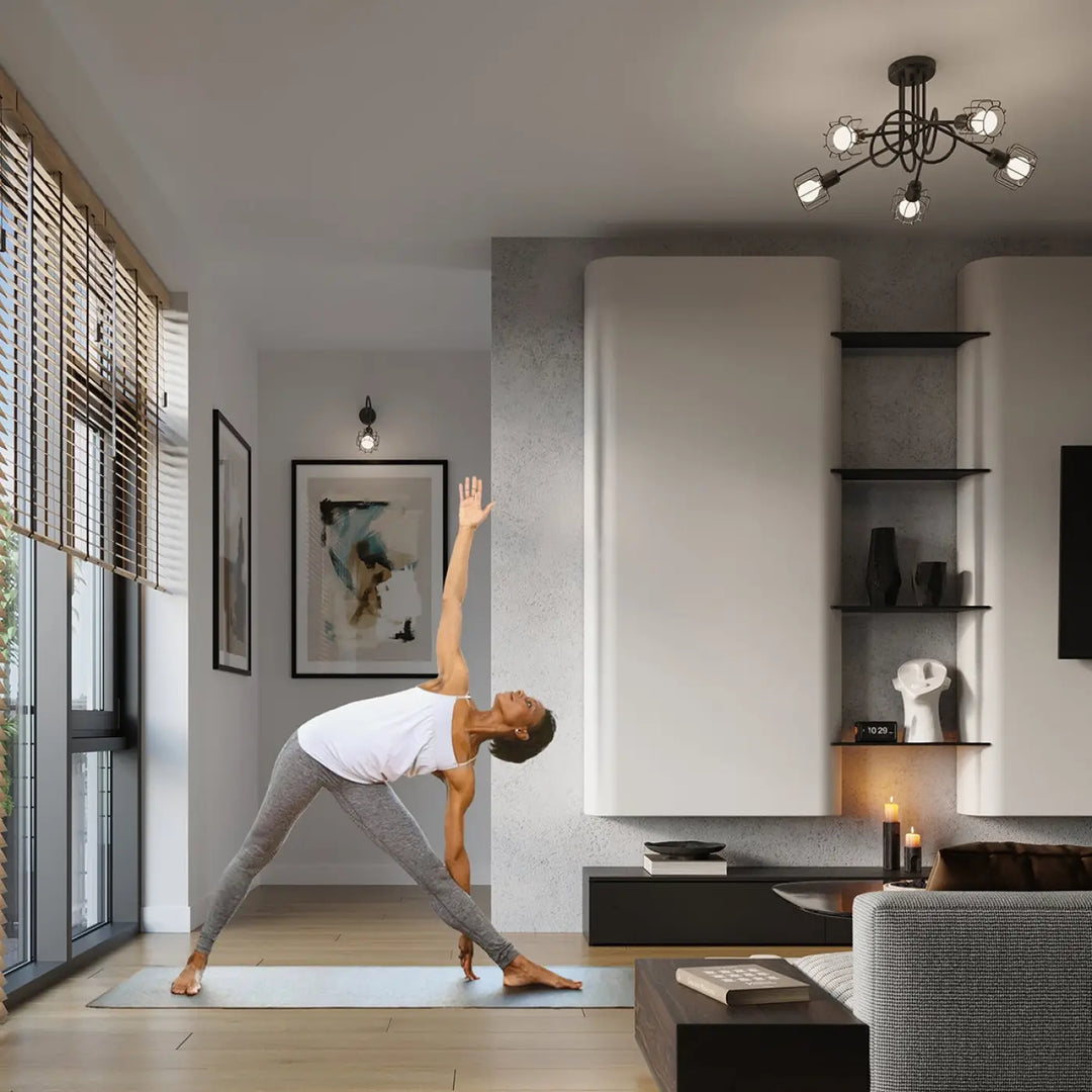 Une femme en tank top blanc et legging gris fait du yoga sur tapis bleu sous luminaire plafonnier beluci 3 noir style loft collection beluci appliques murales
